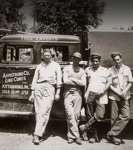 Image of old truck and employees