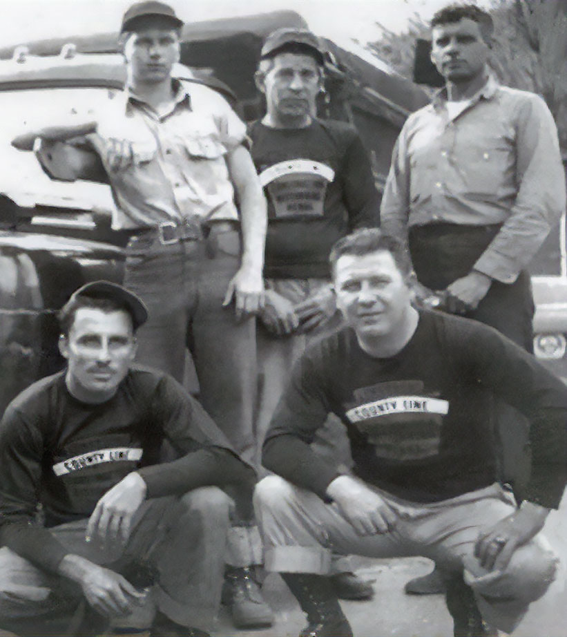 Image of old truck and employees